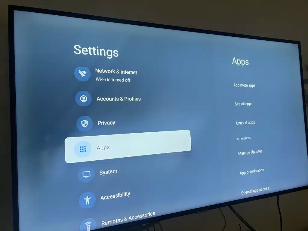 Android TV Settings screen with the Apps option selected for managing installed apps and clearing cache.